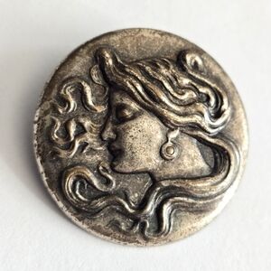 Art Nouveau style brooch woman with flowing hair dark silver tone pin